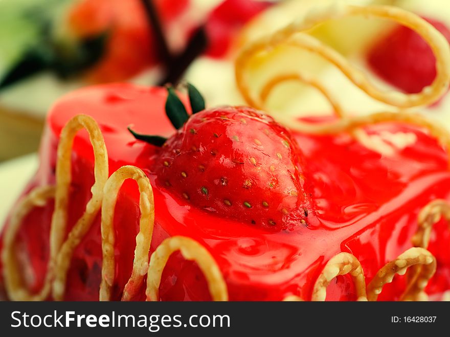 Cake with strawberry topping over white