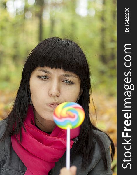 Woman Eating Candy Lollipops