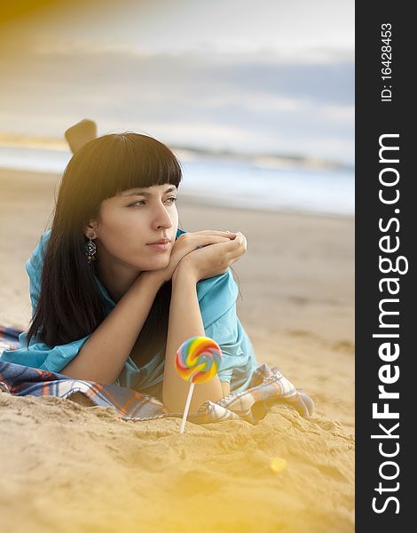Young woman on beach in autumn. Young woman on beach in autumn