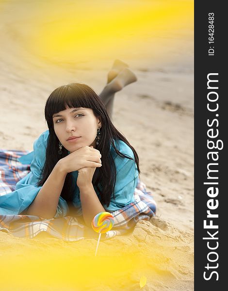 Young woman on beach in autumn. Young woman on beach in autumn