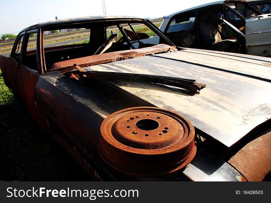 Old abandoned american car in junkyard. Old abandoned american car in junkyard.
