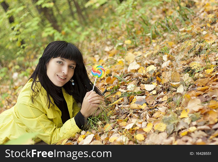 Portrait of a beautiful young woman in the autumn park. Portrait of a beautiful young woman in the autumn park