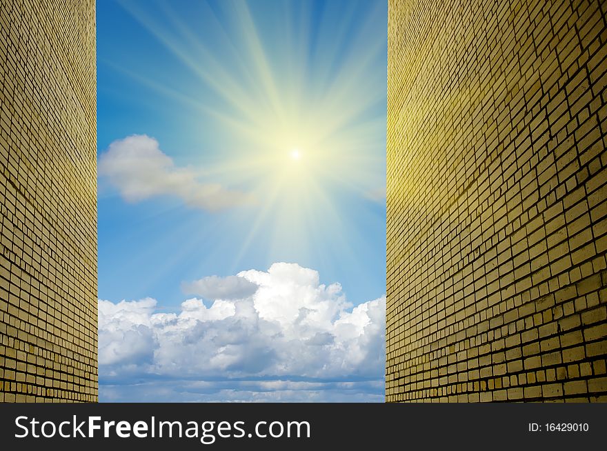Yellow brick wall against the sky