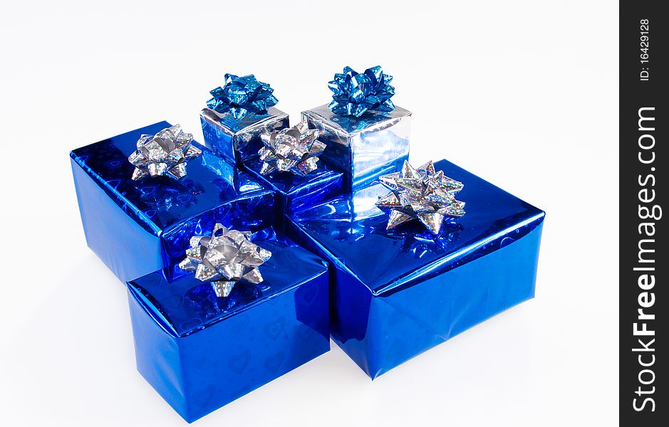 Blue shiny boxes for gifts with ribbons