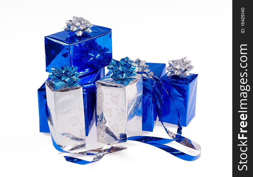 Many blue shiny boxes for gifts with ribbons