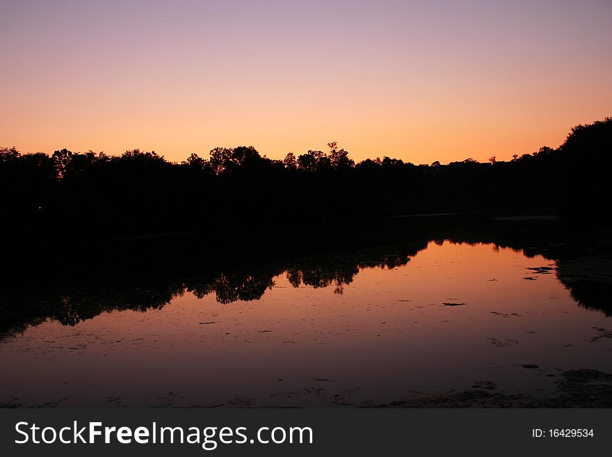 Beautiful dawn and evening colors at sunset over a lake