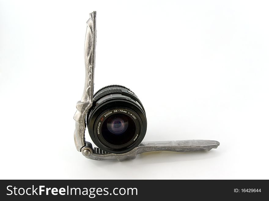 Nutcracker and lens on white background