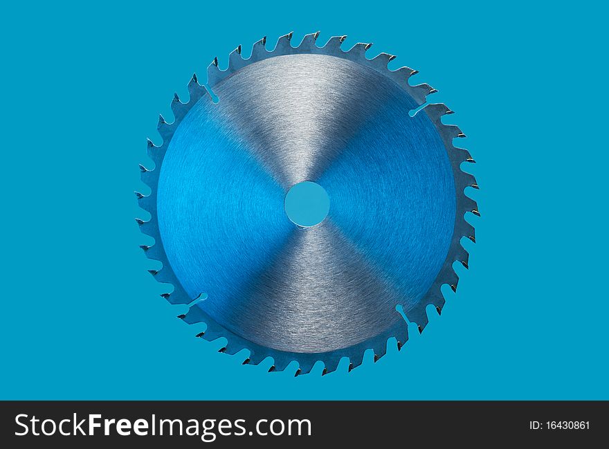 Saw blade on a blue background