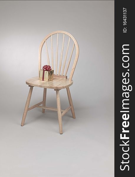 Chair with present or gift to give on top of seat