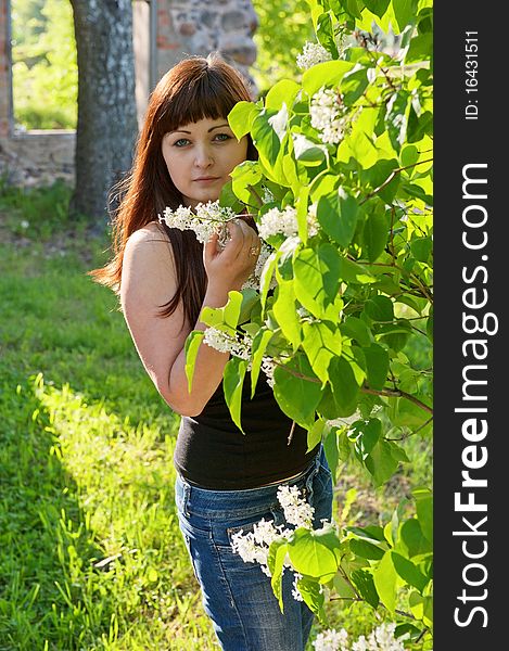 Young beautiful woman stand at pipe-tree with ruins on the background. Young beautiful woman stand at pipe-tree with ruins on the background.