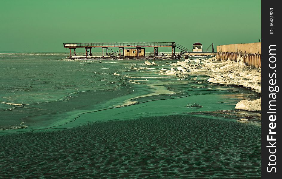 The bridge on the sea in the spring, thaws ice and snow. The bridge on the sea in the spring, thaws ice and snow