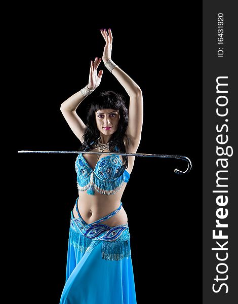 Woman in blue dance with cane on black background