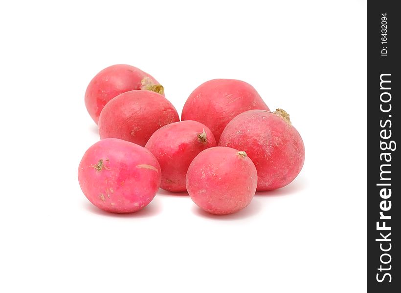 A pile of garden radishes isolated on a white background