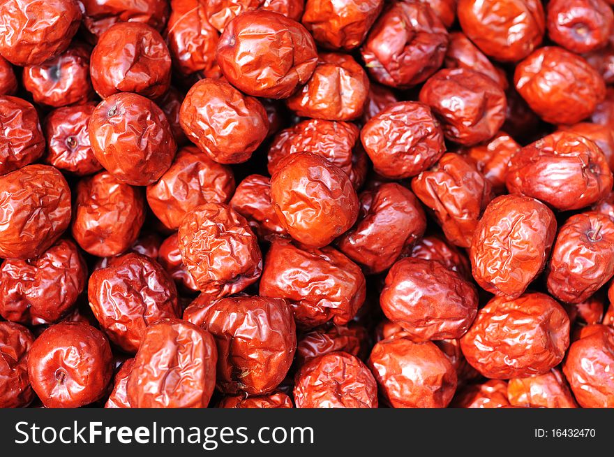 A pile of red Chinese date(or jujube) in autumn. A pile of red Chinese date(or jujube) in autumn.