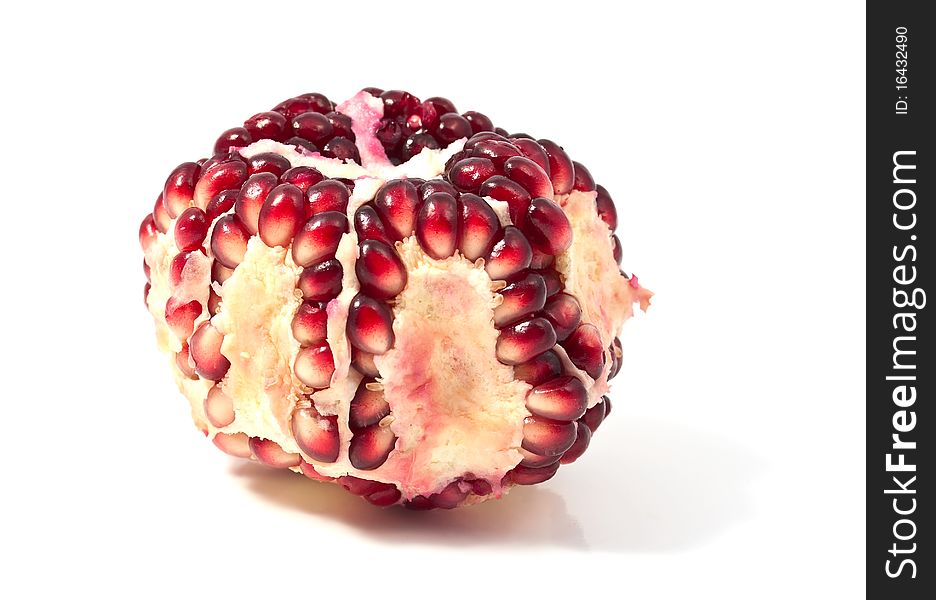 Pomegranate seeds on a white background