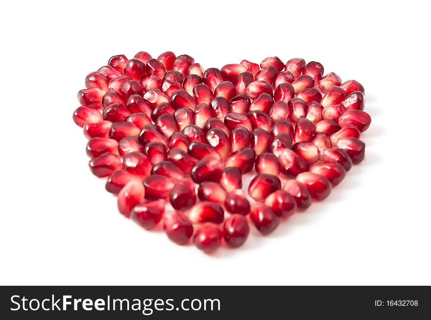 Valentine's heart shape made by pomegranate seeds