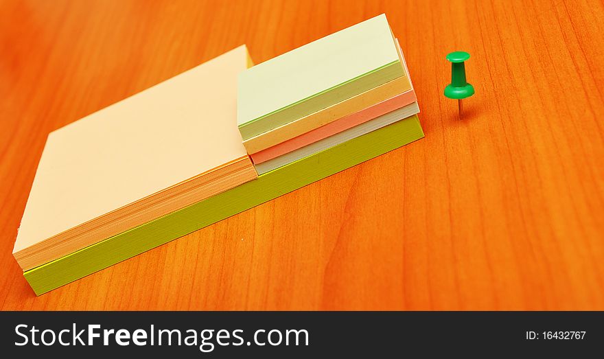 Pile colored note papers and office accessories