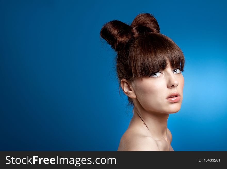 Beauty young girl on the blue background