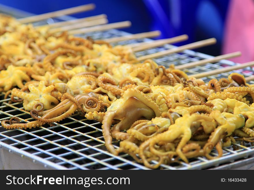 Grilled octopus in the street market, Thailand