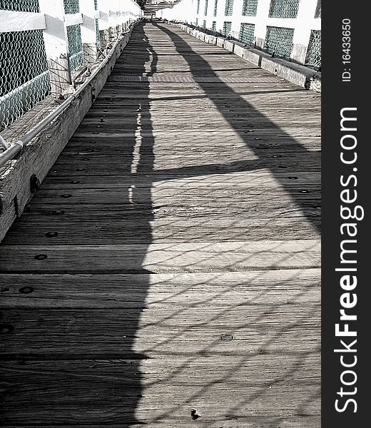 Weathered timber beams with white painted timber railings form this old Footbridge. Weathered timber beams with white painted timber railings form this old Footbridge.