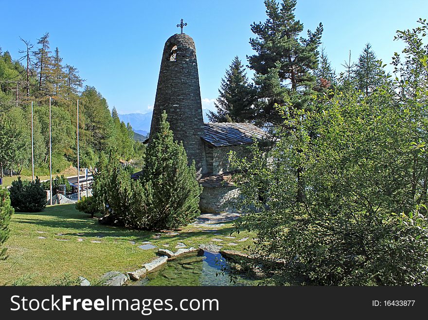 A small church nestled in the woods in the Italian Alps. A small church nestled in the woods in the Italian Alps.