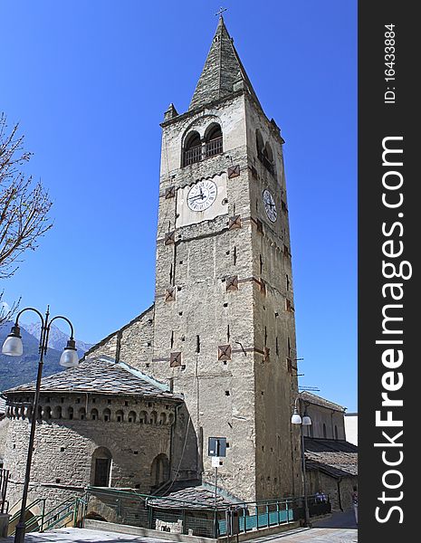 Image of an ancient church in the Italian Alps and its beautiful bell tower. Image of an ancient church in the Italian Alps and its beautiful bell tower