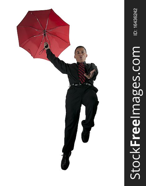 A guy flying with a red umbrella. A guy flying with a red umbrella
