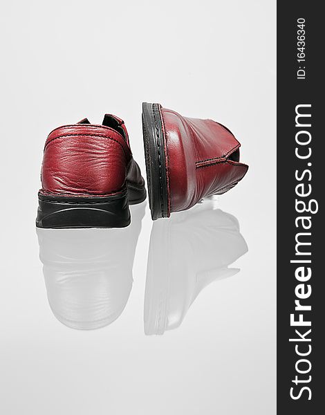 A red leather shoes reflexion. A red leather shoes reflexion