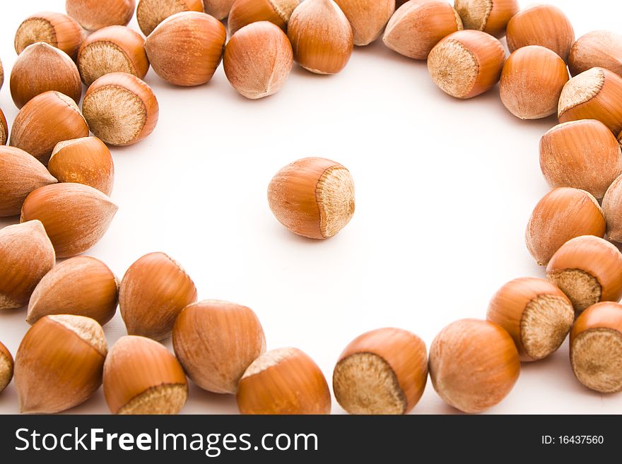 Brown haselnuts isolated on white