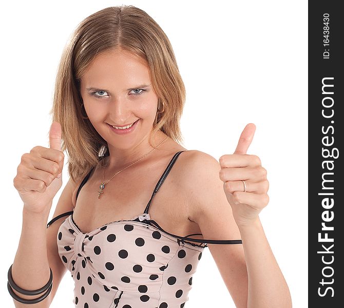 Young blond woman giving a thumbs up sign and smiles. Positive fresh shot isolated over white background.