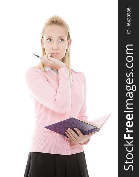 Pensive blonde girl with pen and diary/copybook isolated on white