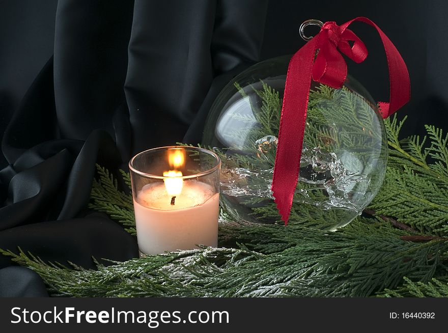 Christmas composition with crystal ball and candle. Christmas composition with crystal ball and candle