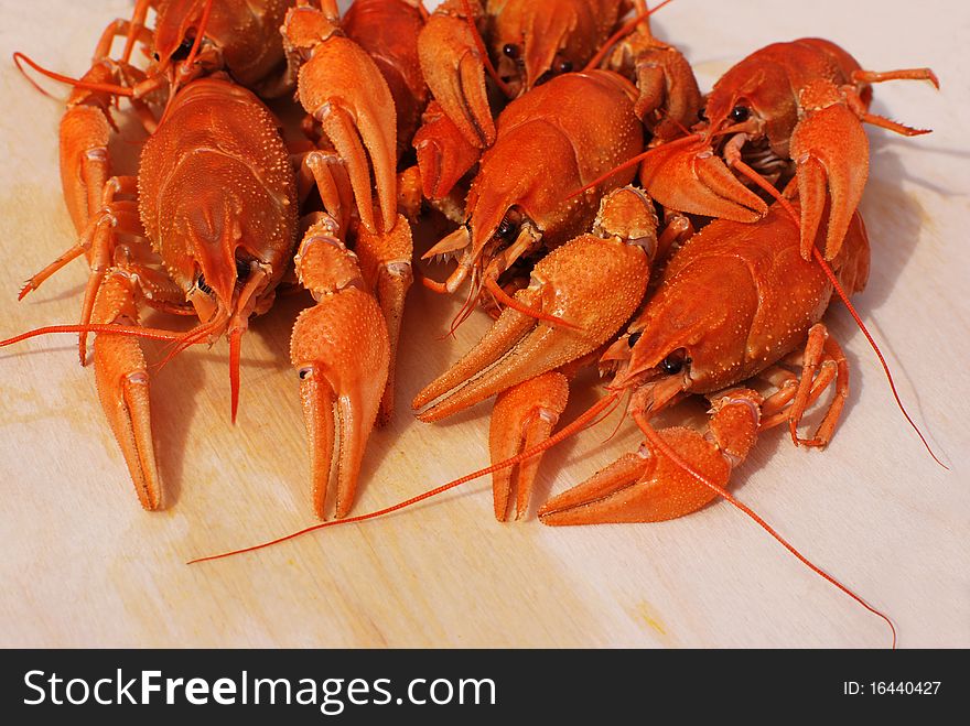 Boiled red crayfishes on table. Boiled red crayfishes on table