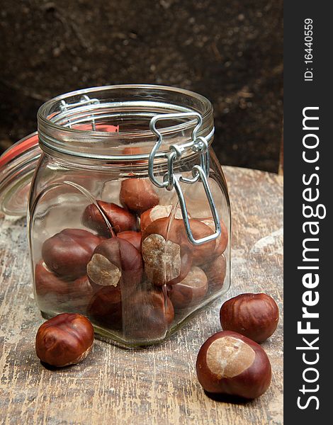 Chestnuts in the pot on the old wood