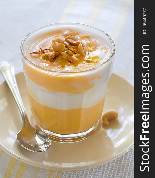 Delicious and creamy pumpkin soup in glass