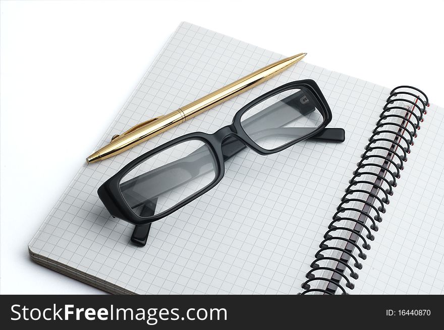 Organizer, glasses and pen. Isolated on white background