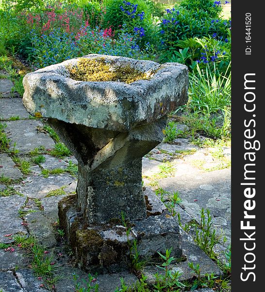 Old bird bath in a local park. Old bird bath in a local park