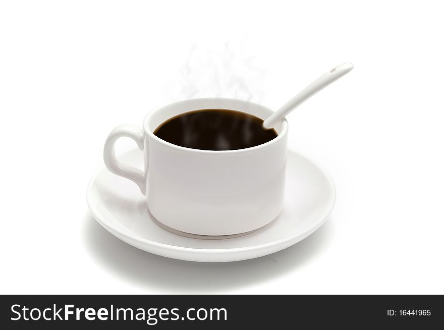 White coffee cup with a spoon on the saucer isolated on white background