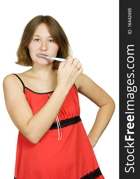 Attractive woman is cleaning of her teeth over white. Attractive woman is cleaning of her teeth over white