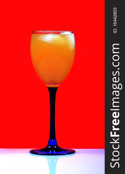 Orange juice isolated on red background. Orange juice isolated on red background.