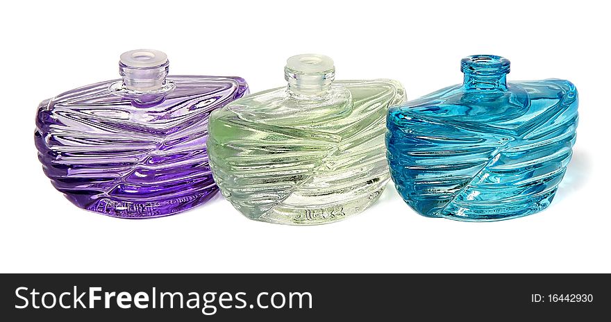 Three bottles of perfume isolated on a white background