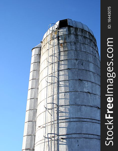 A photograph of a Silo on a clear blue sky background.