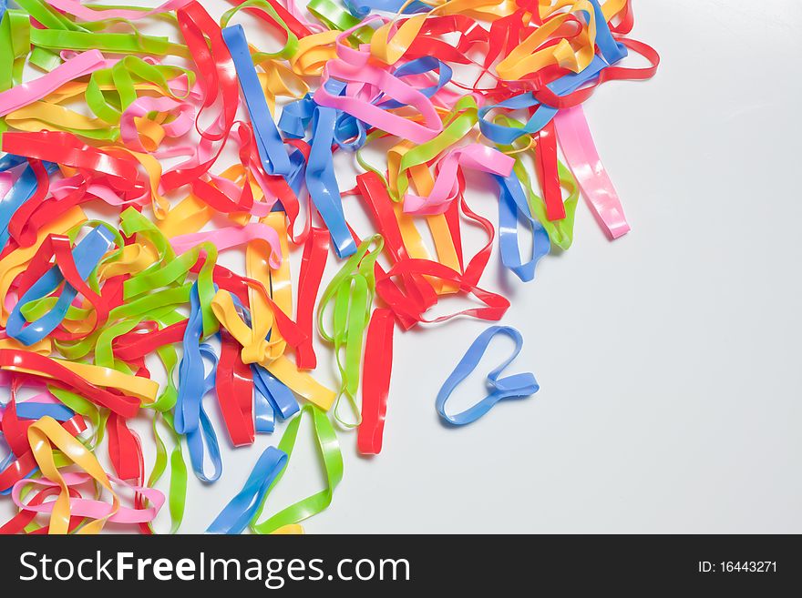 Colorful rubber bands on white background