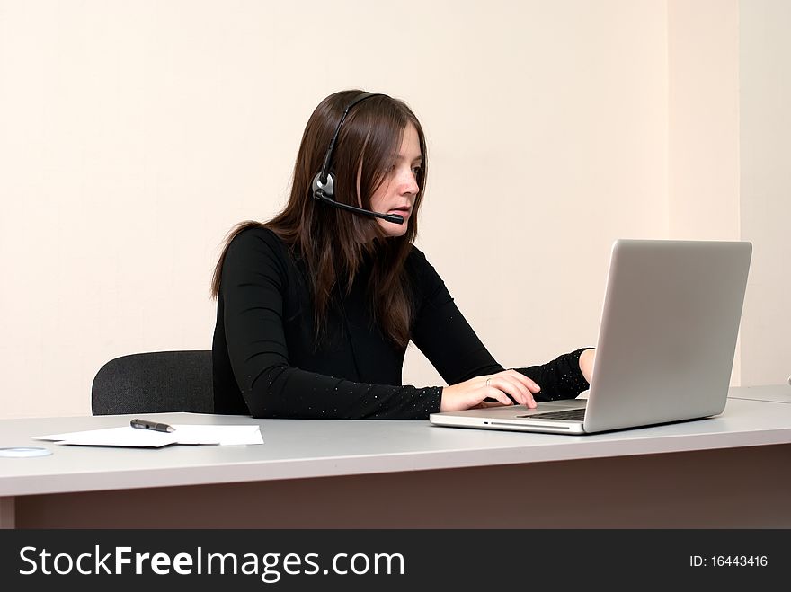 Business woman with laptop and headset. Business woman with laptop and headset