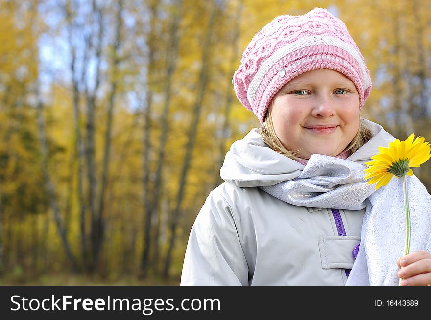 Little girl with a yellow flower