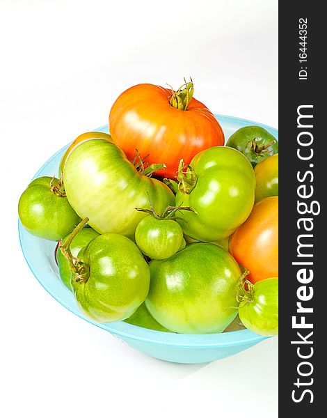 Tomatoes fresh cut from the vine ripening in bowl. Tomatoes fresh cut from the vine ripening in bowl