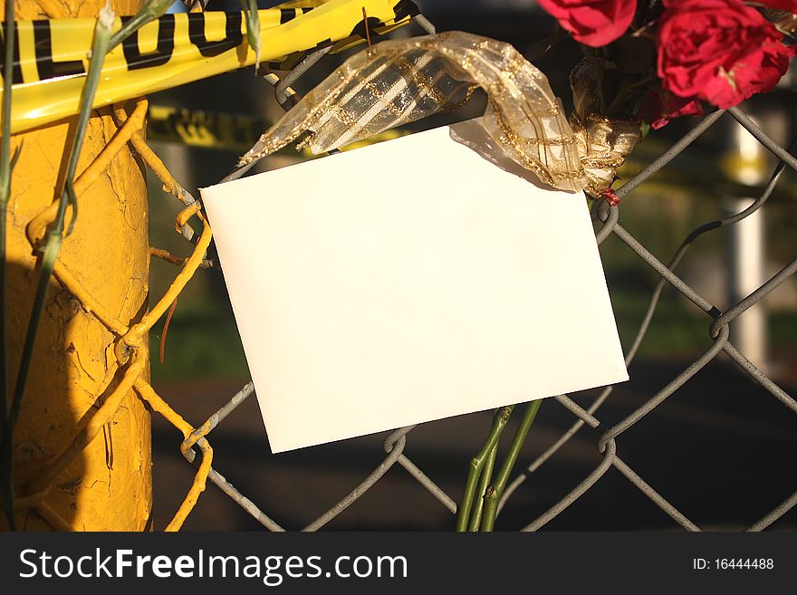 Card hanging on a fence in memory of. Card hanging on a fence in memory of