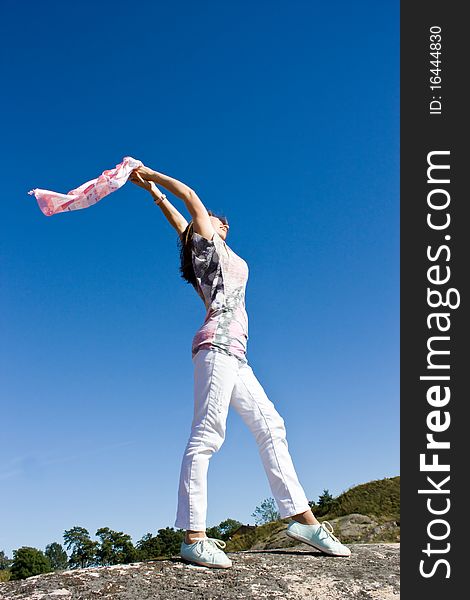 Happy Young Lady Playing With Scarf