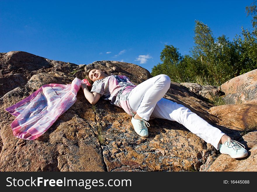 Happy Brunette Playing With A Scarf In The Summer