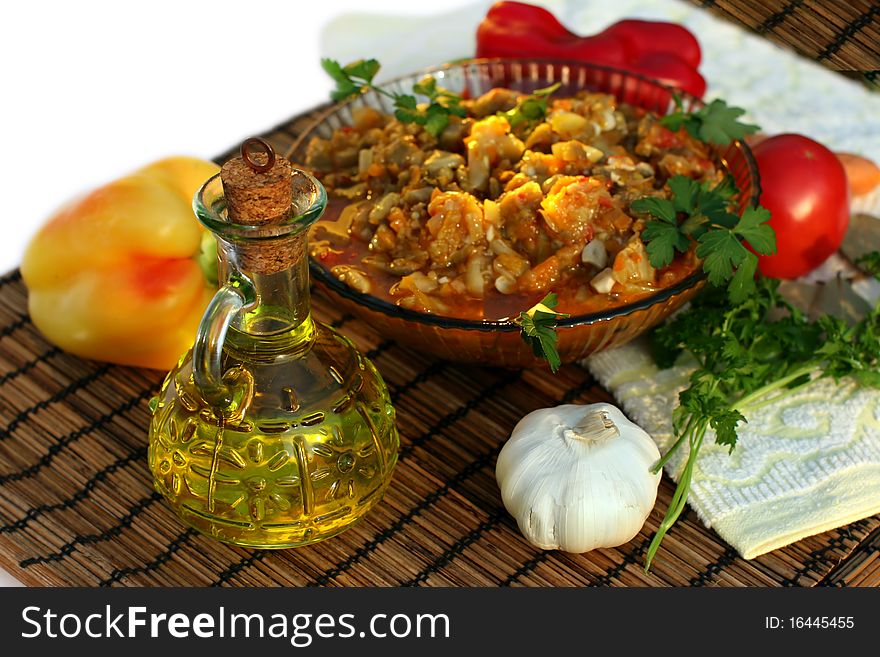 Appetizing vegetable ragout of aubergine with  tomato, pepper, garlic.